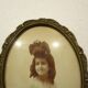 Old wall frame in carved wood and gilded stucco, oval