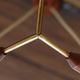 Scandinavian chandelier "Cascade" from the 1960s in brass, teak, and smoked glass.
