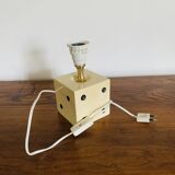 Lamp base representing a die