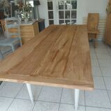 Farmhouse table with pearl gray base and raw wood top.