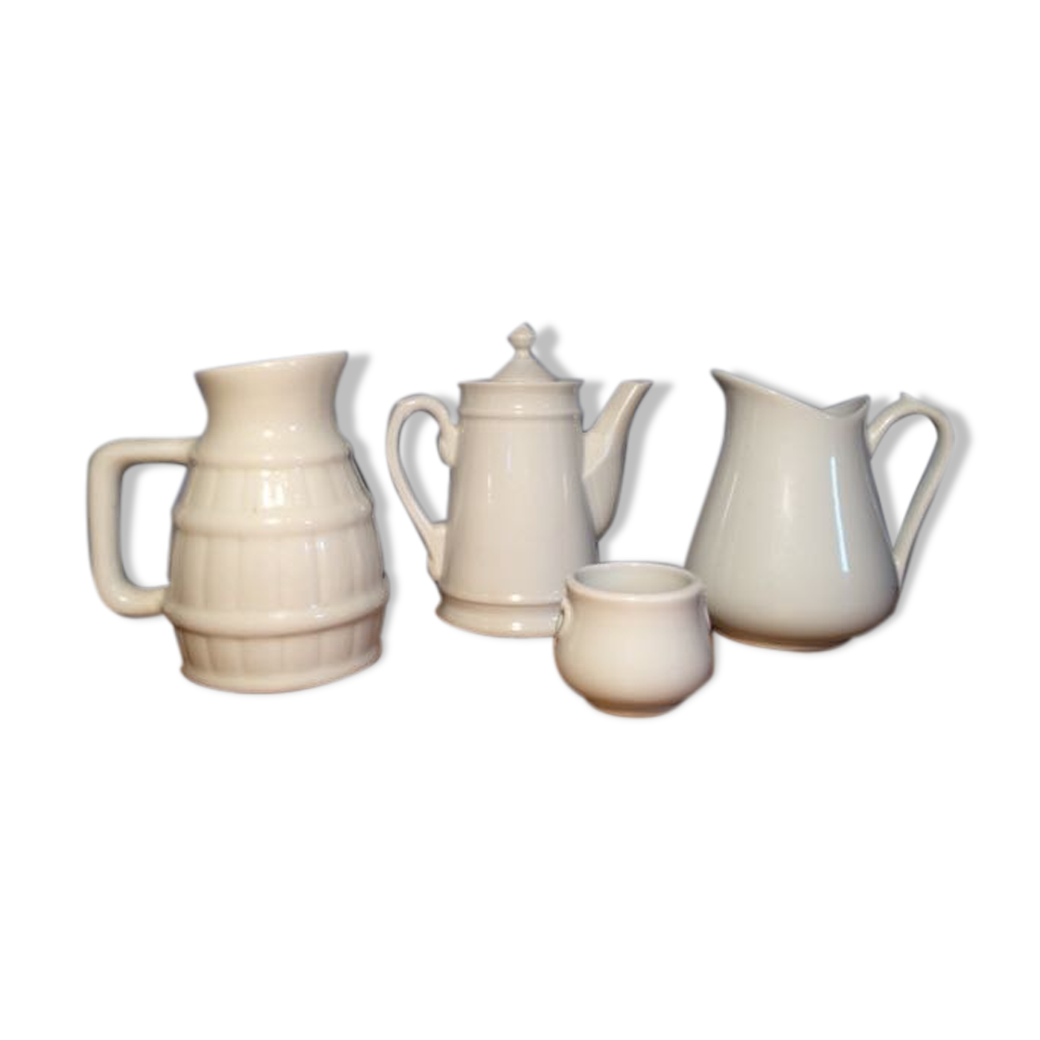 Trio of pitchers and jam jar