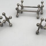 Set of 6 old table knife resistors in the shape of crossbars in silver metal