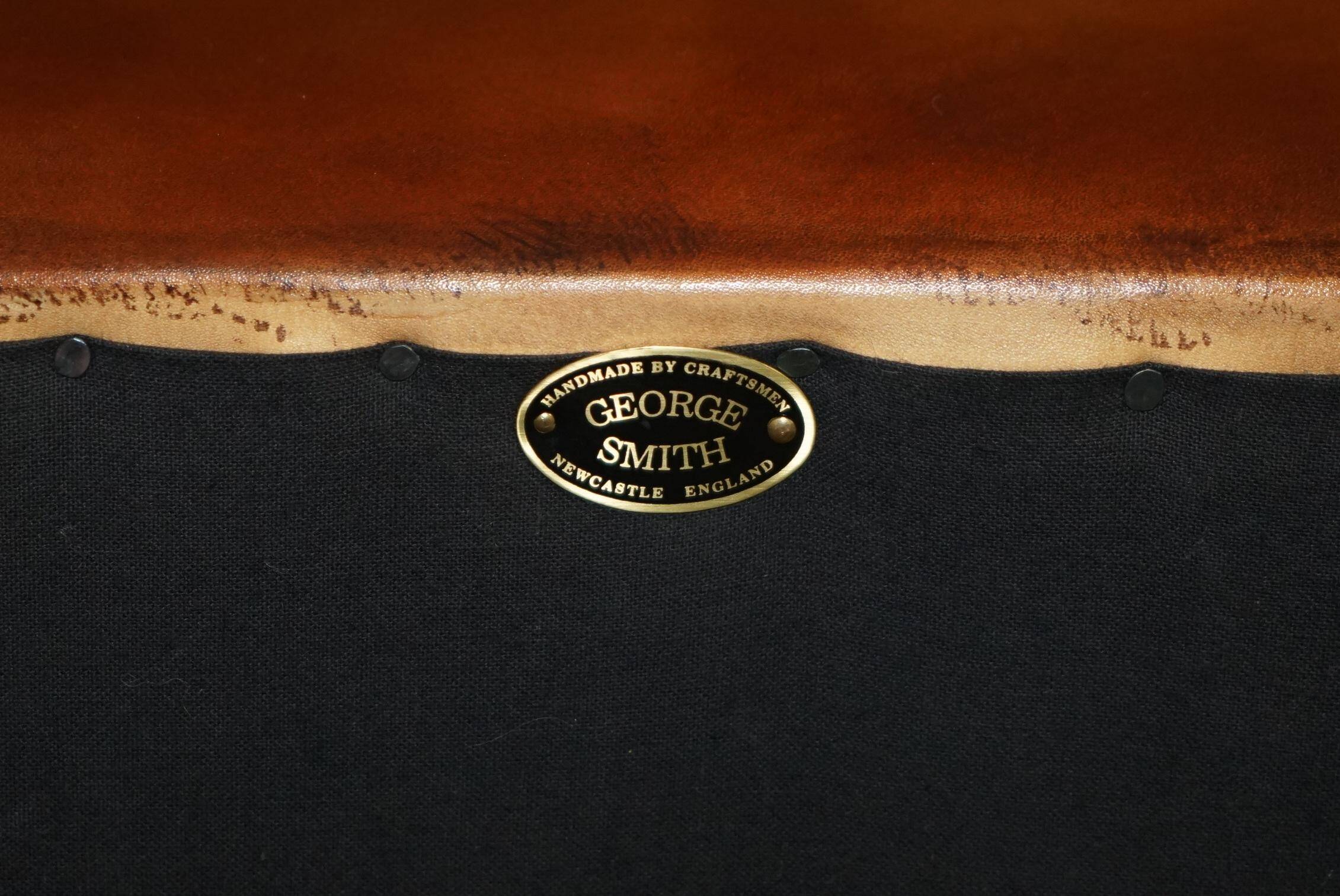 Pair of Early Victorian leather Chesterfield sofas by George Smith.