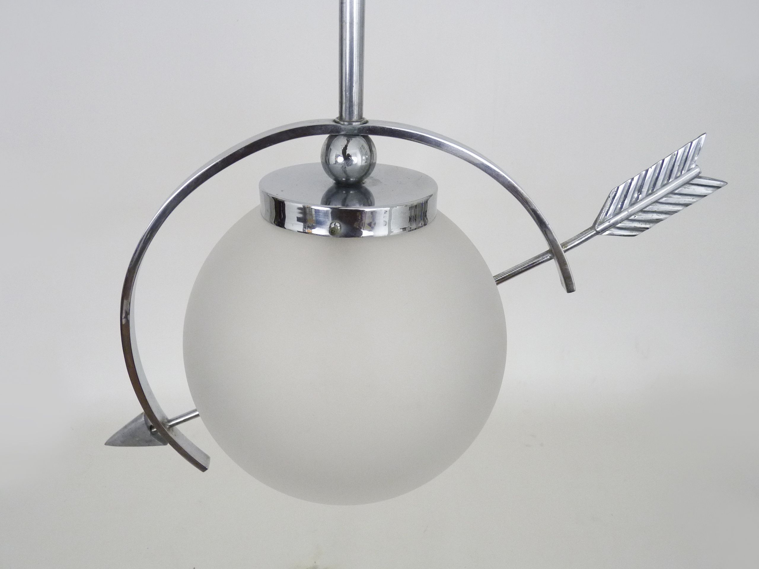 Suspension in chromed metal and glass, space age, arrow crossing a globe. Seventies