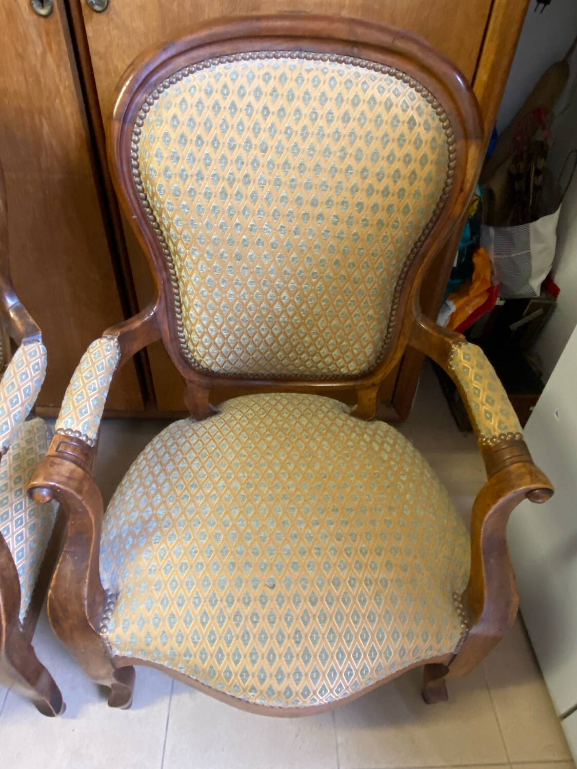 Two Louis XV style wooden and fabric armchairs