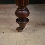 Old round table with folding shutters on casters in solid wood in very good condition