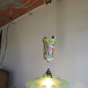 "Very old light fixture" with a "rise and fall" counterweight adorned with butterflies.