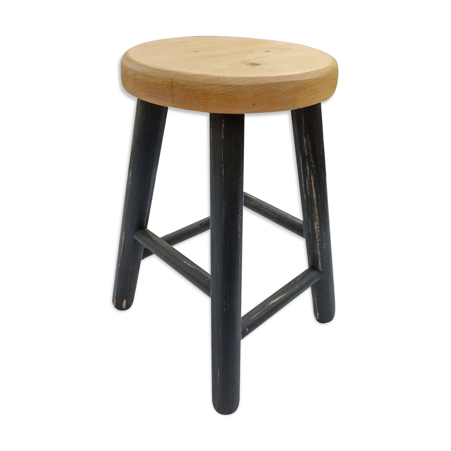 Low wooden stool and black patina