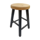 Low wooden stool and black patina