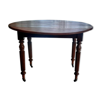 Old round table in walnut Louis Philippe style