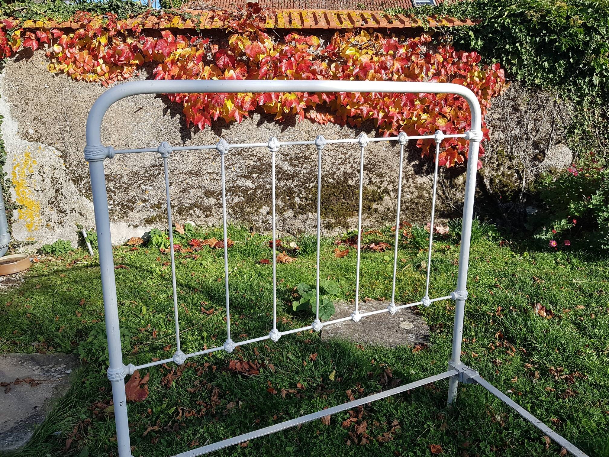 Old white metal bed from 1900