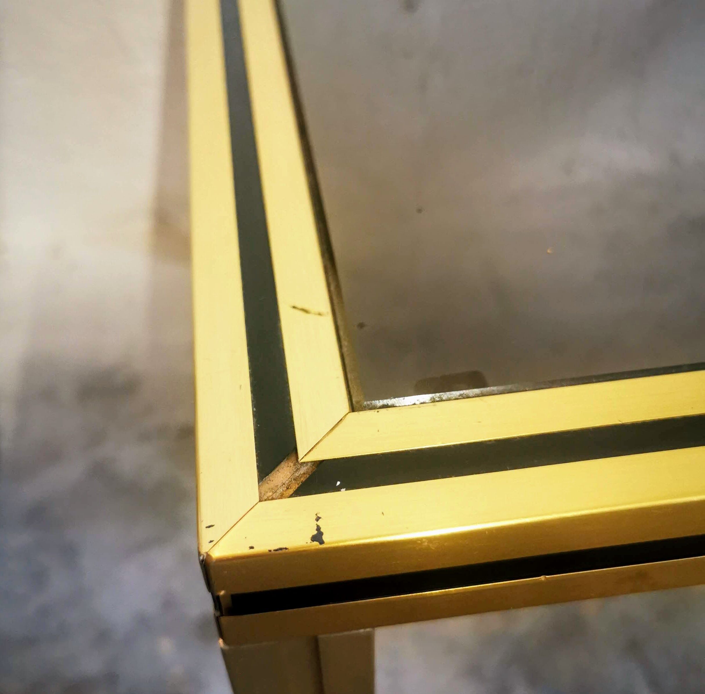 Gold metal side table and smoked glass