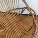Shell rattan armchair