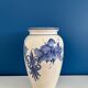 Vintage white and blue ceramic vase with floral pattern