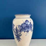Vintage white and blue ceramic vase with floral pattern