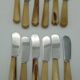 Twelve vintage butter knives