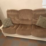 Vintage sofa in wood and fabrics.