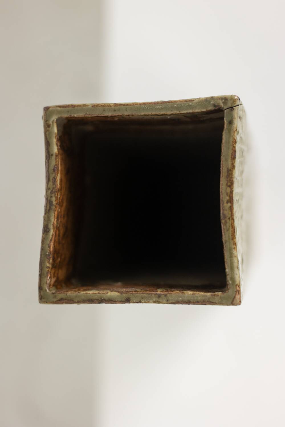 Brutalist stoneware vase with a plant motif. 1970s.