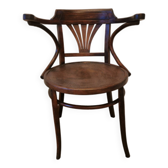 Armchair in curved wood