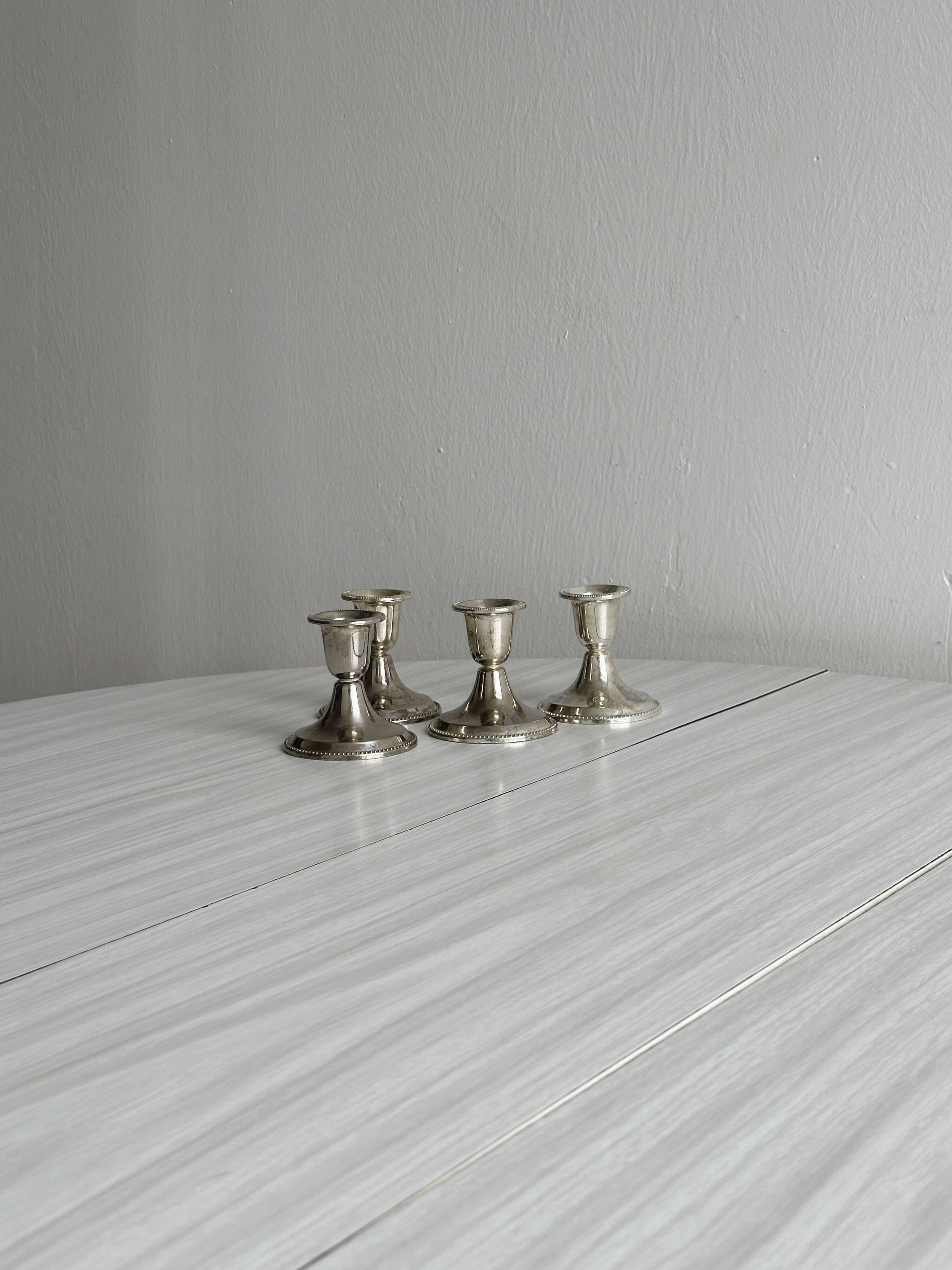 4 vintage metal candle holders