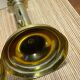 Duo of brass push candle holders