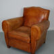 Vintage french moustache back cognac-colored leather club chair