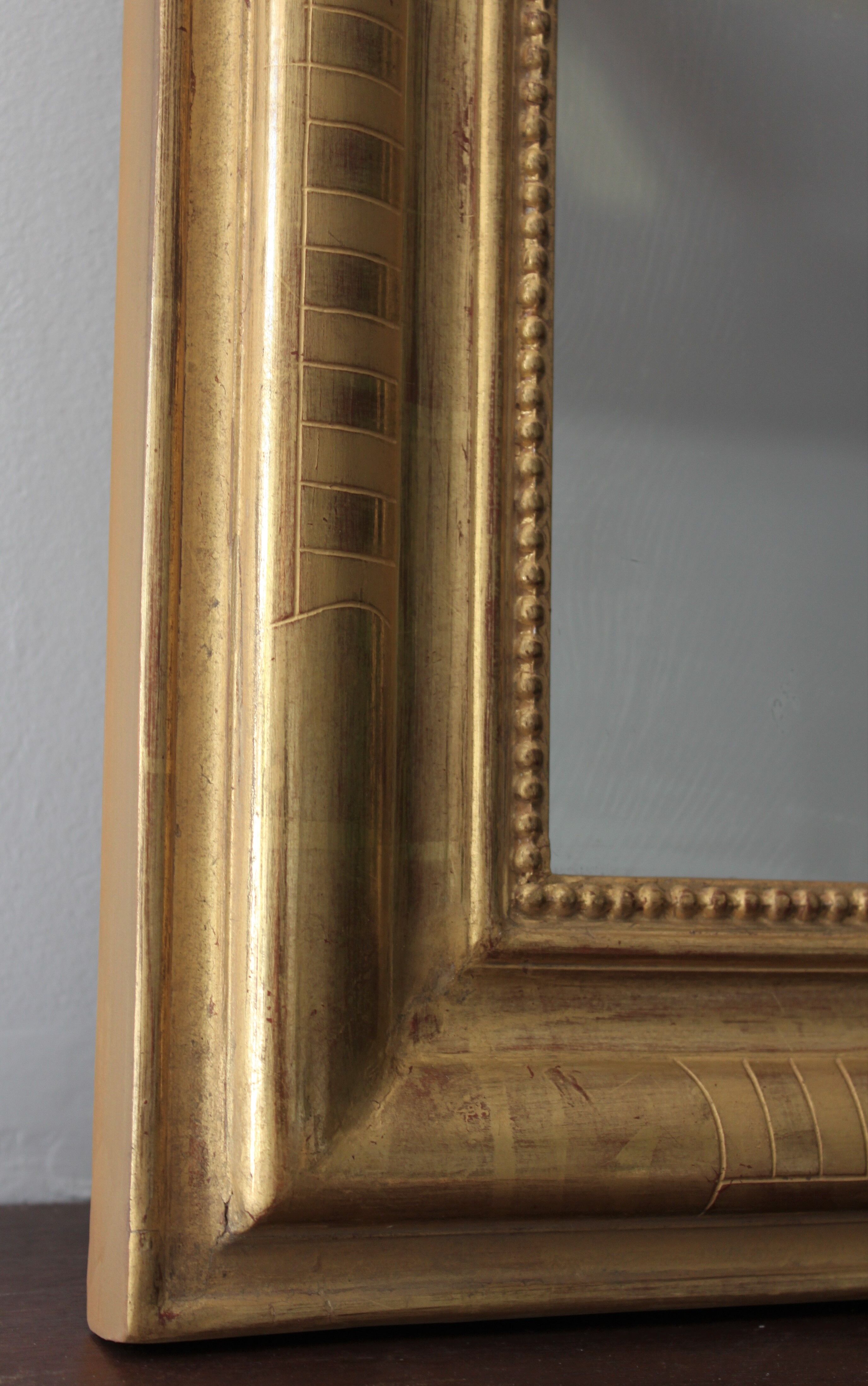 Louis Philippe mirror gilded with gold leaf and original ice dated 1879