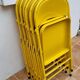 Ensemble de six chaises en métal pliantes jaunes Eurosit