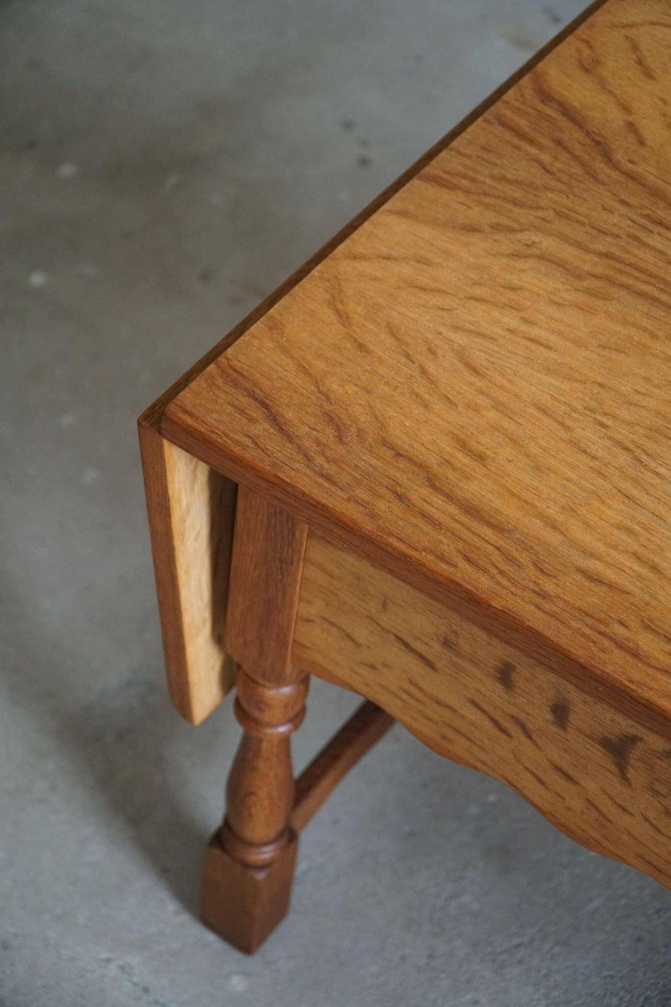 Danish folding table from the mid-century with a drawer in oak, Henning Kjærnulf, 1960s.