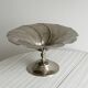 large dish on a shiny metal stand