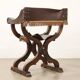 Antique neo-Renaissance folding chair in walnut and leather, Italy, 20th century.