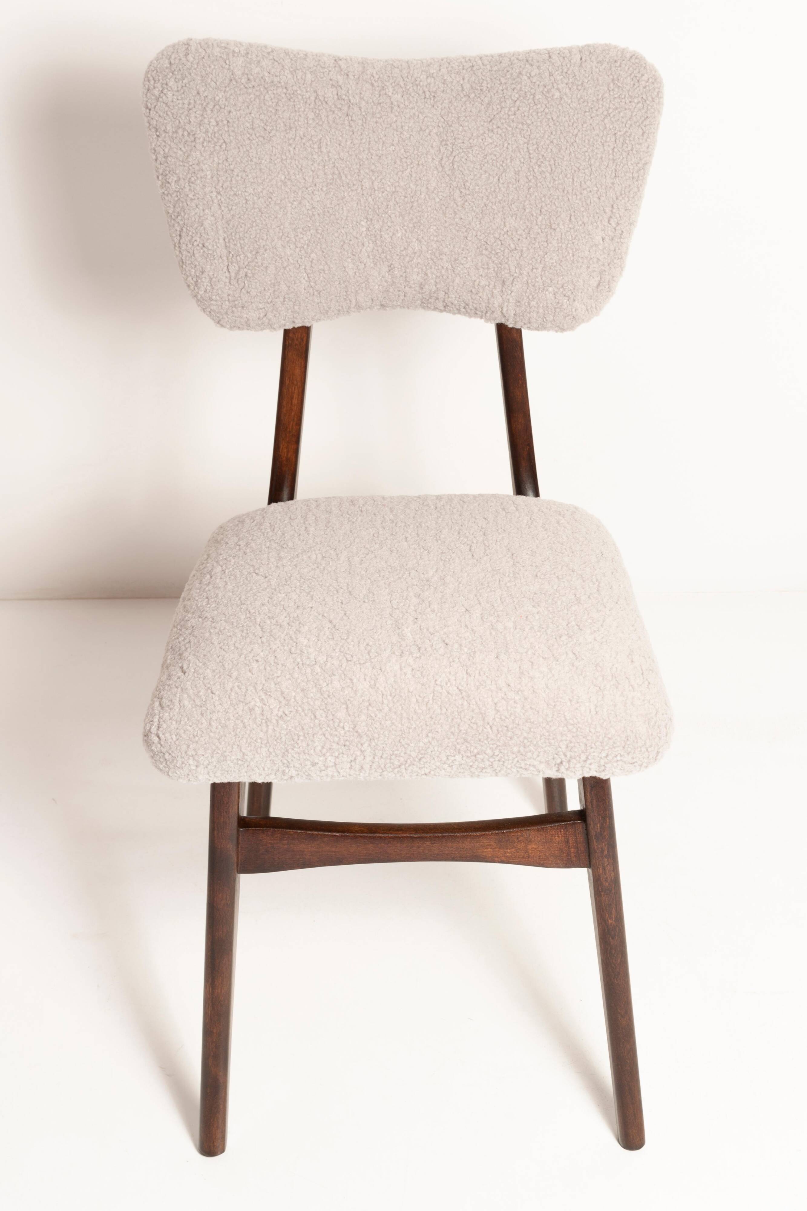 Mid-century butterfly chair, light grey boucle, dark walnut wood, Europe, 1960s.