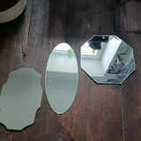 Three beveled mirrors