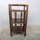Small rattan and wood shelf