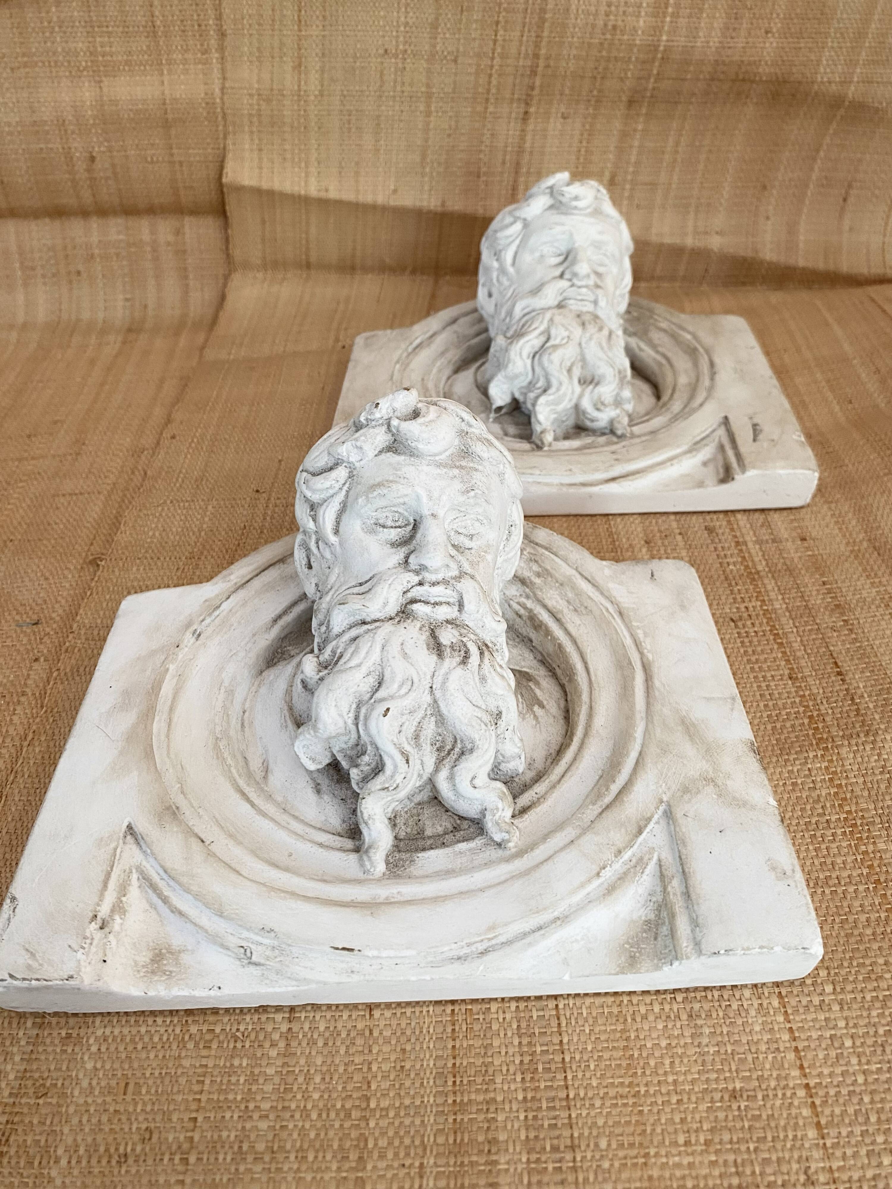 Two moulds; plaster heads