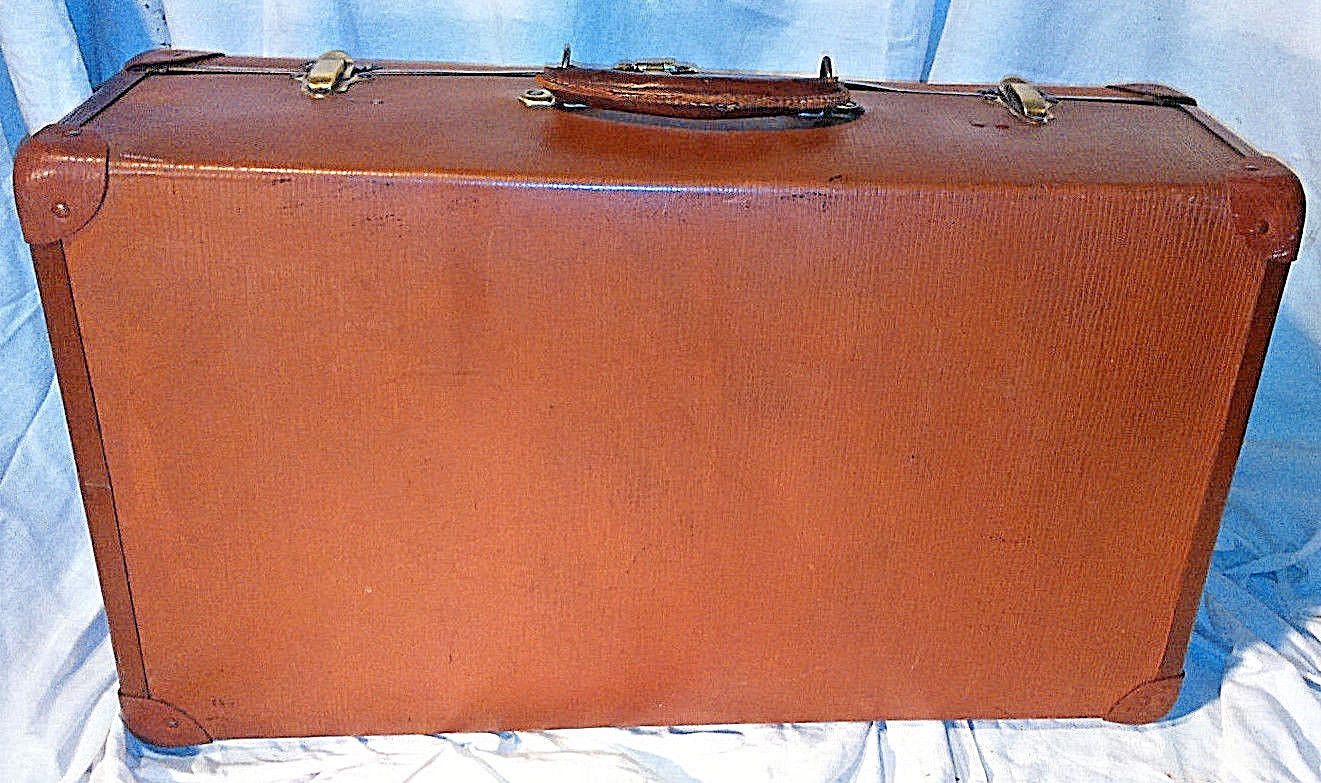 Old vintage black and white cardboard storage suitcase travel