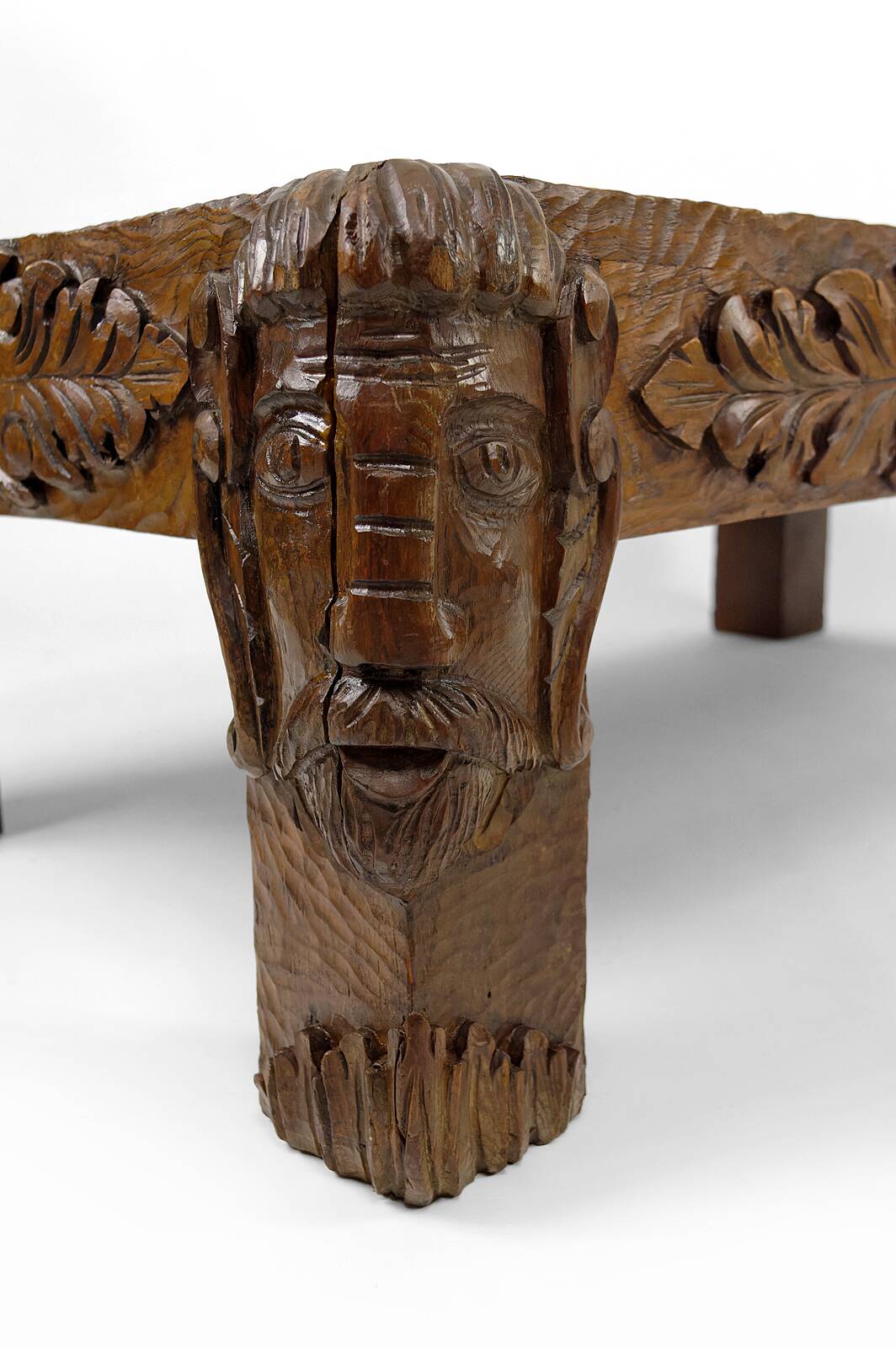 Solid oak coffee table carved with fauns and gray marble top, France, circa 1940