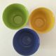 Set of three pastel two-tone mini bowls in glazed ceramic.