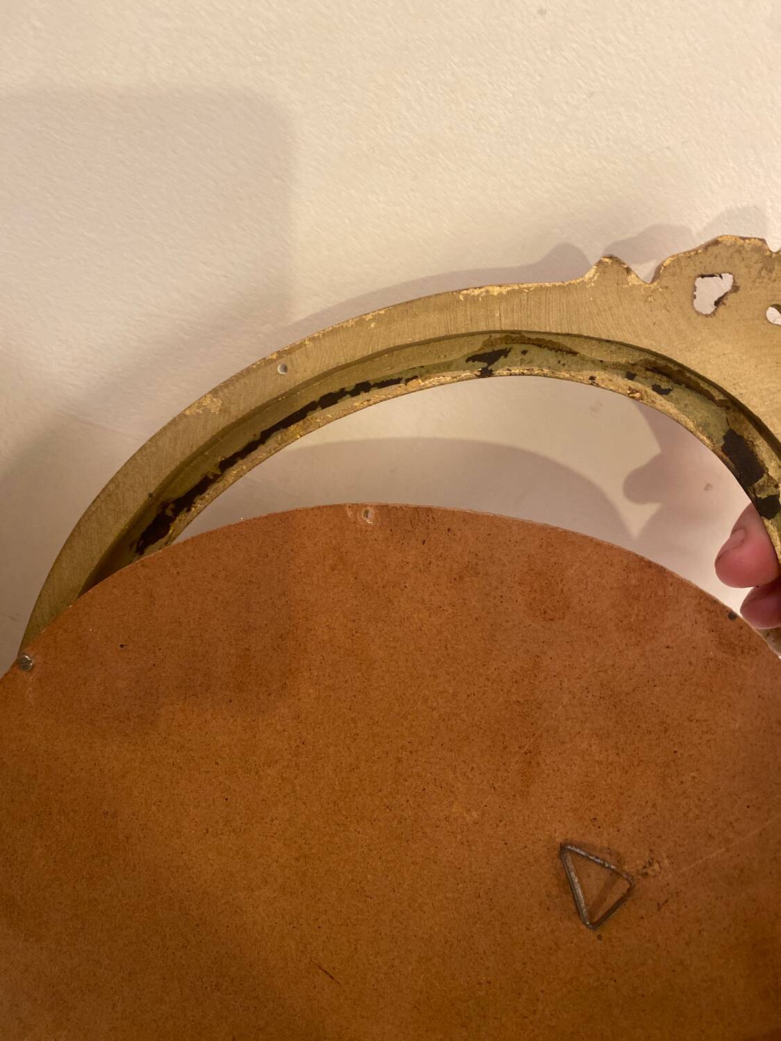 Golden oval wooden frame