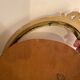 Golden oval wooden frame