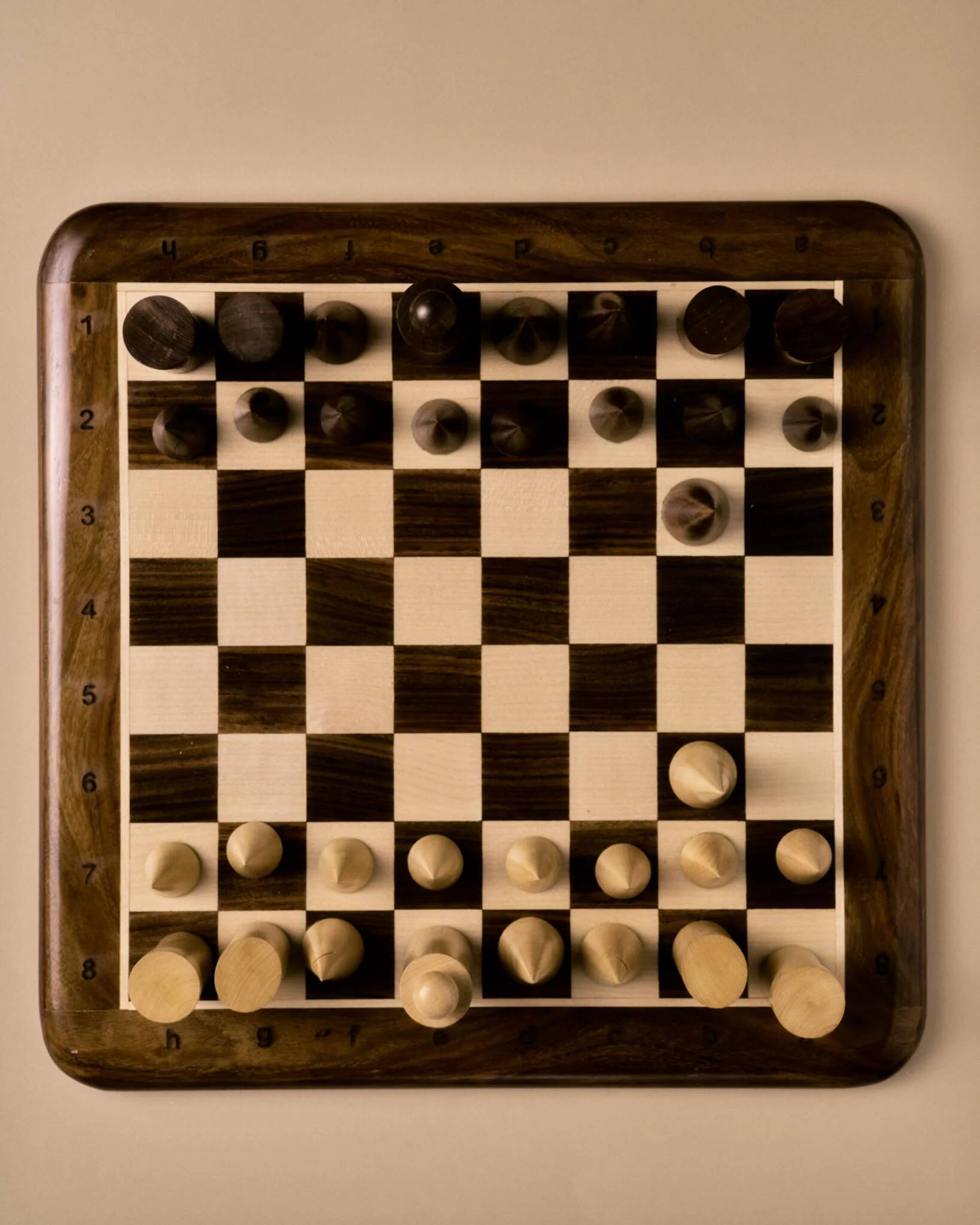 Wooden chessboard, geometric pieces