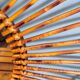 Asymmetrical sun mirror in rattan - vintage 1960s