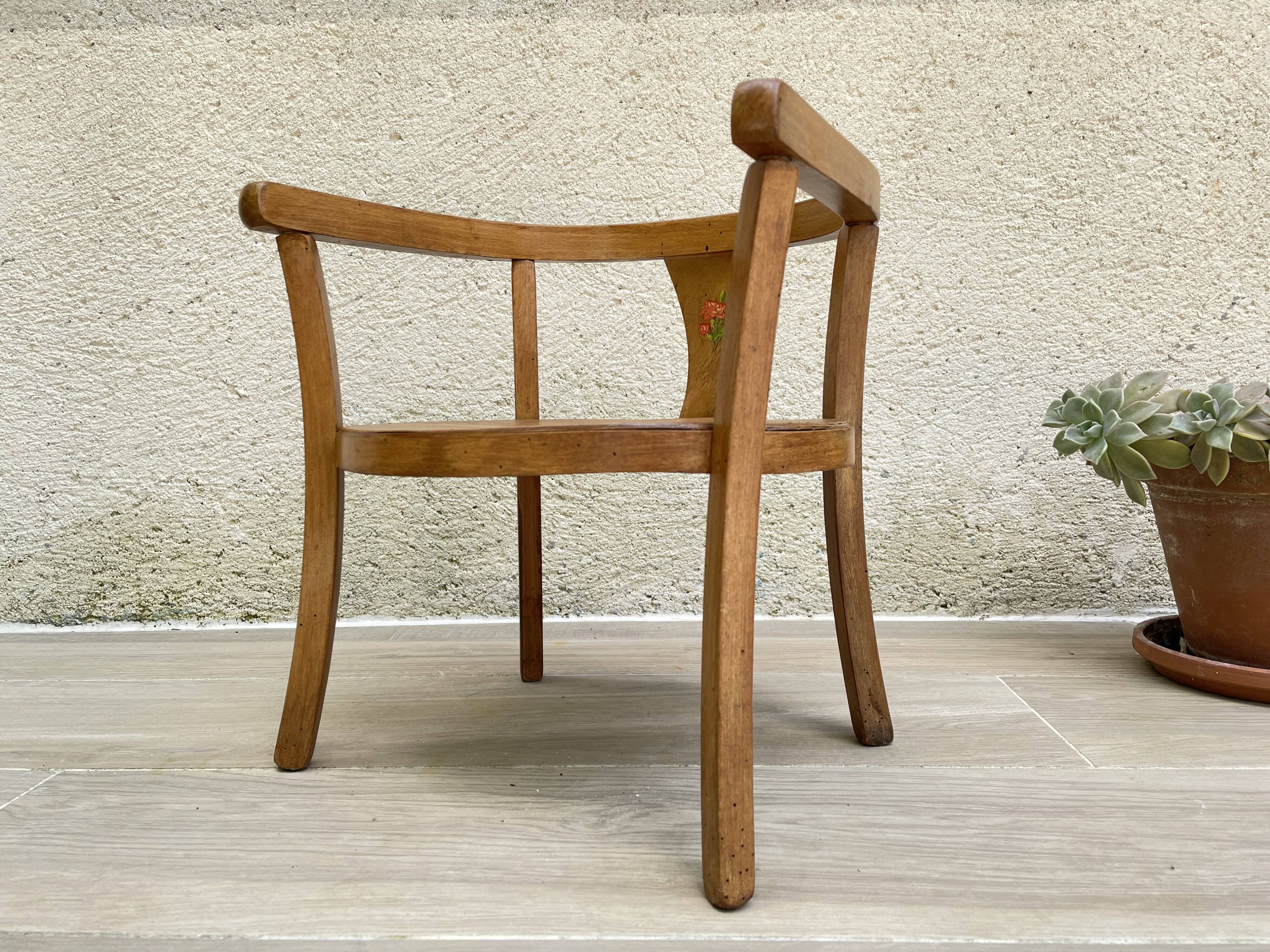 Old armchair for children in wood