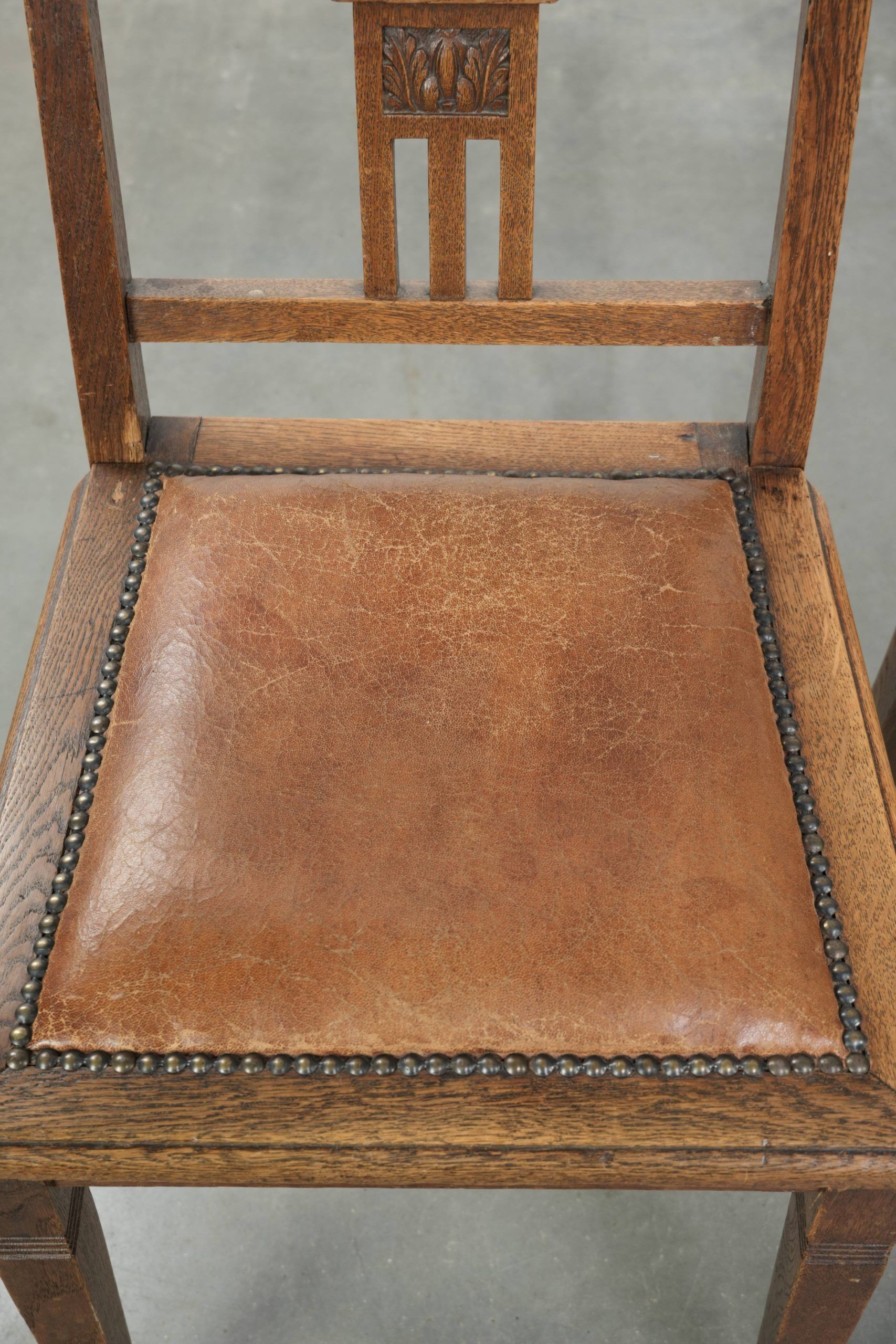 Set of 4 antique oak dining chairs in Art Nouveau style with sheepskin