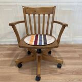 Solid wood swivel and reclining armchair.