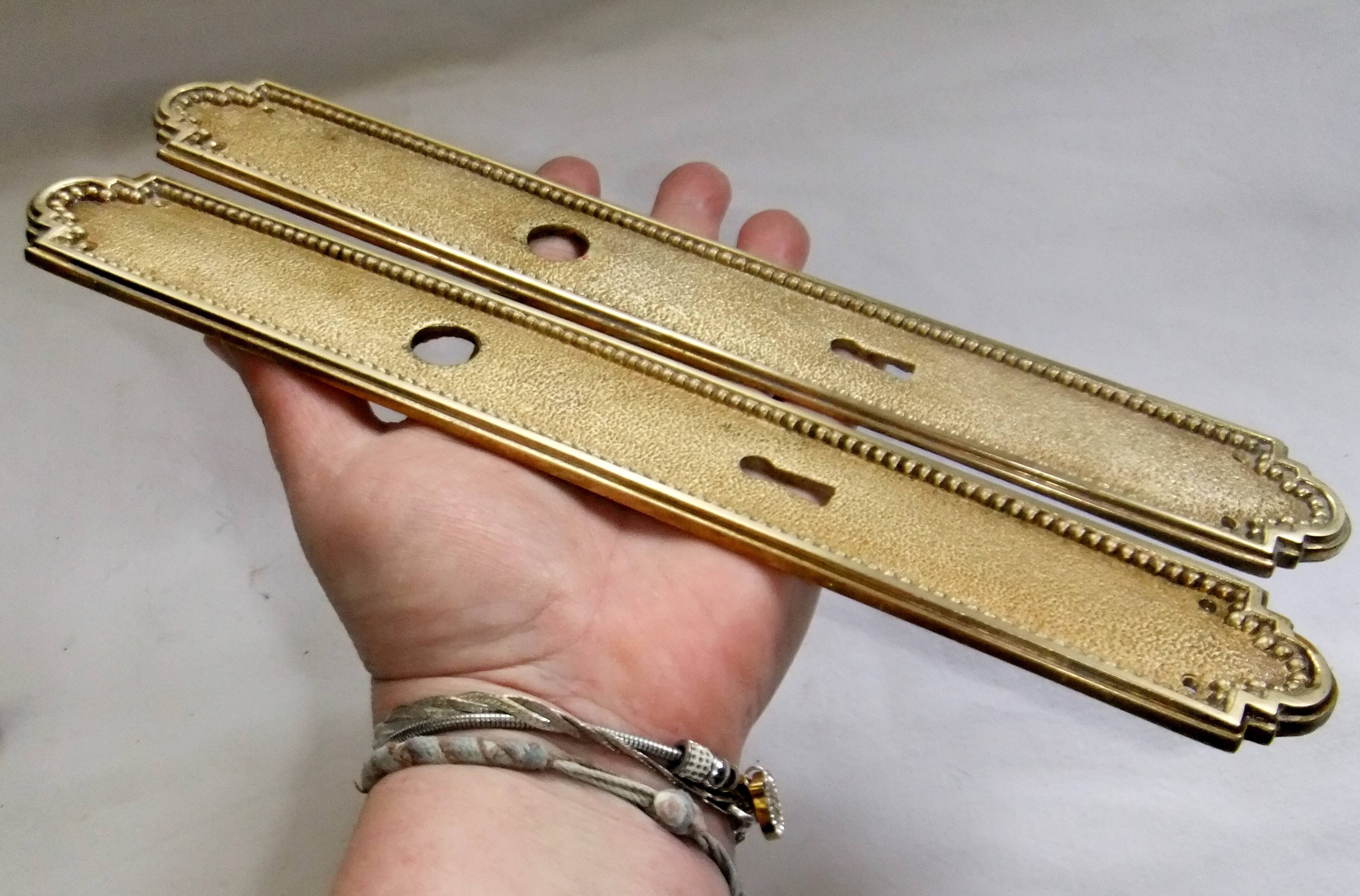 Pair of Louis XVI style beaded bronze door handles