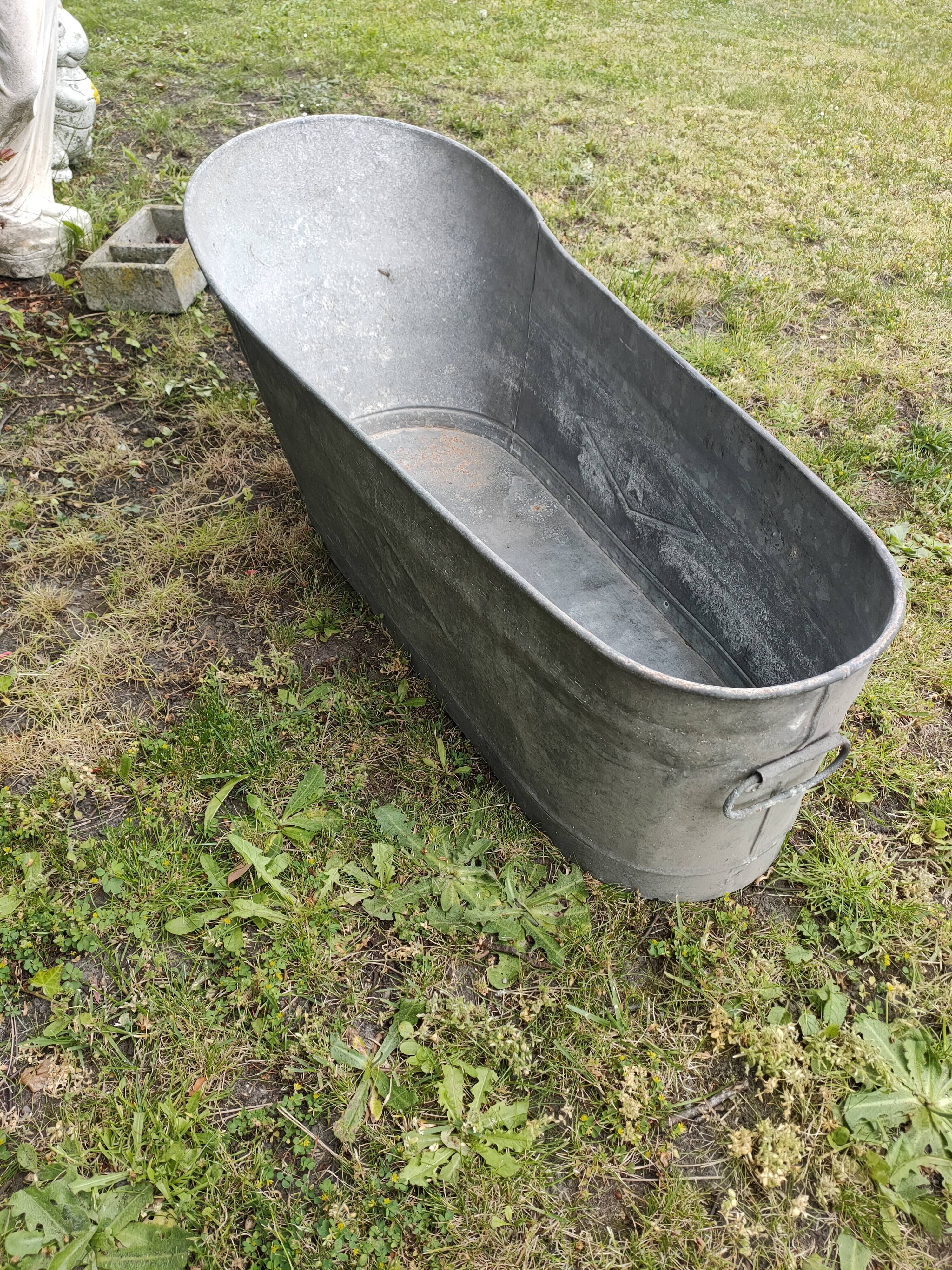 Antique children's bathtub in zinc