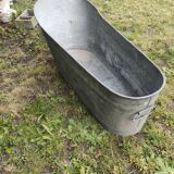Antique children's bathtub in zinc
