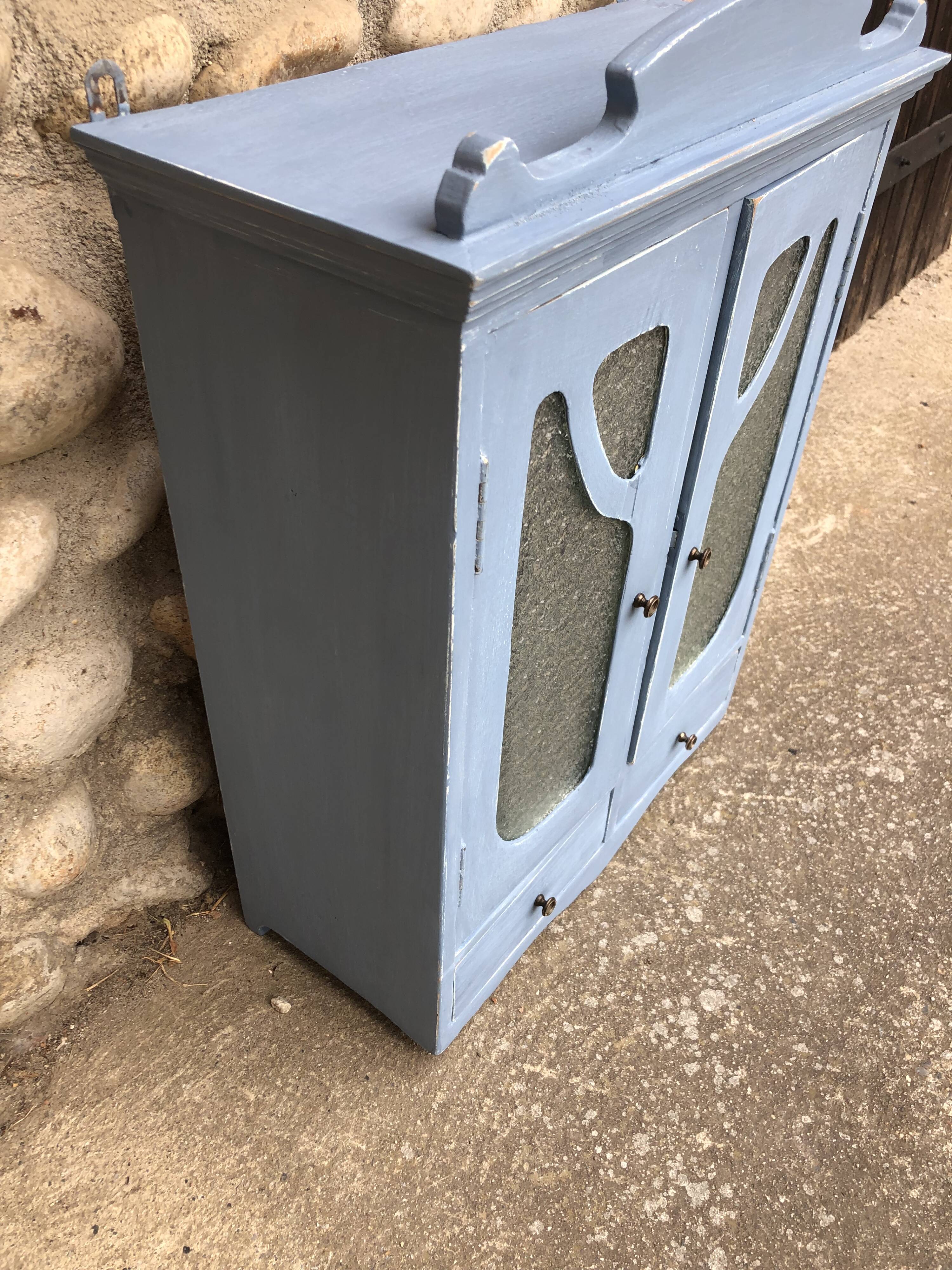 Pastel patinated medicine cabinet