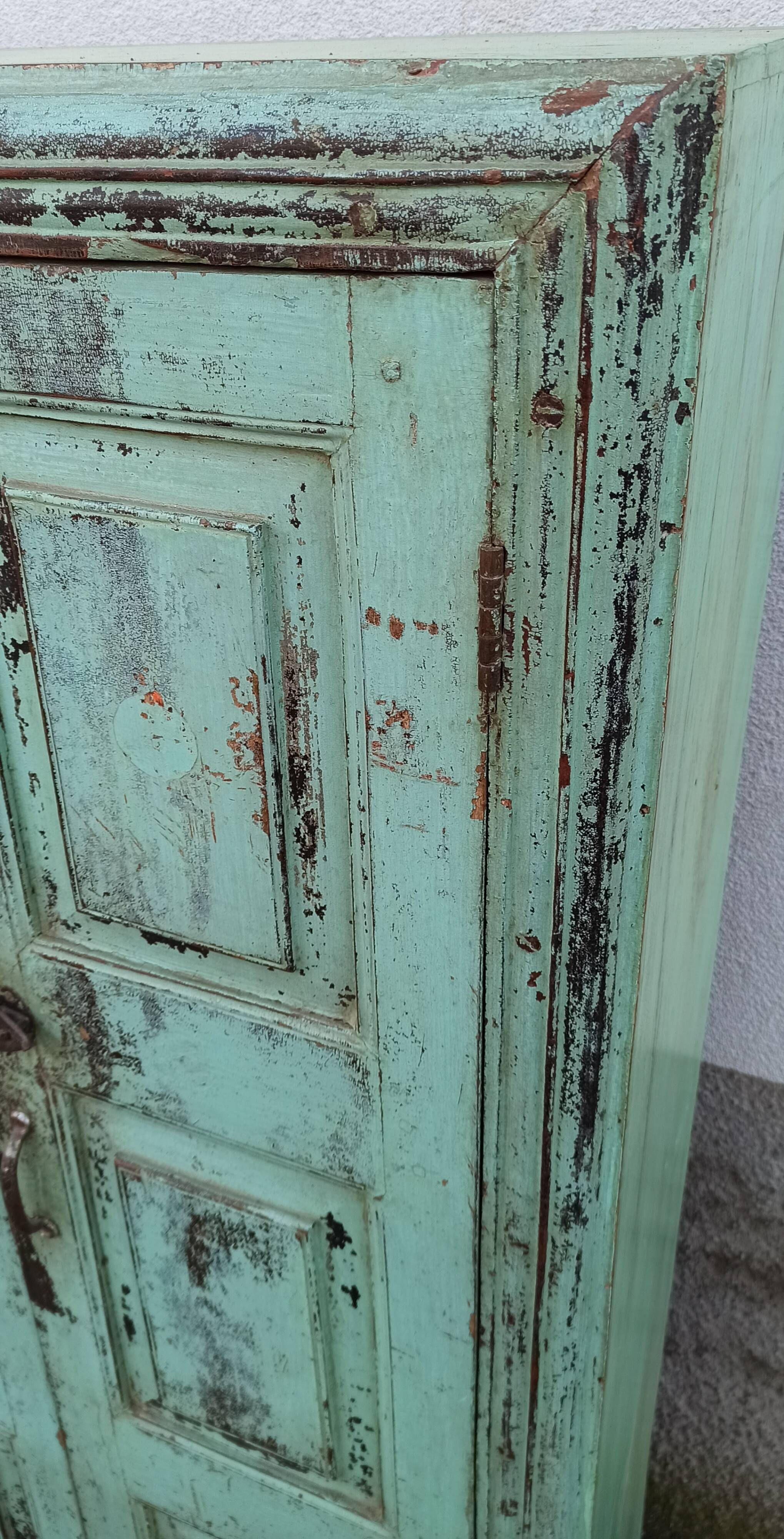 Old wooden cabinet with beautiful green patina